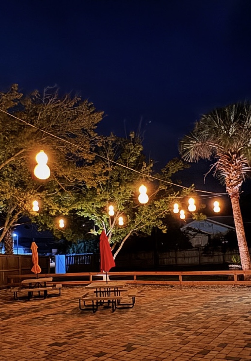 Festoon string lights over patio